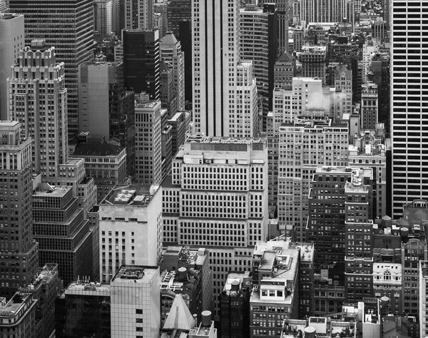 NEW YORK, USA - May 03, 2016: Black and white image of streets and roofs of Manhattan on a cloudy day. New York City skyline. Birds eye view of Manhattan