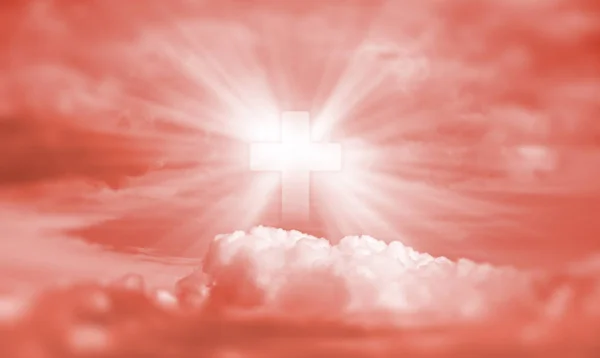 Religious concept. Sign of faith. Cross in the sky.  Image in trendy living coral color