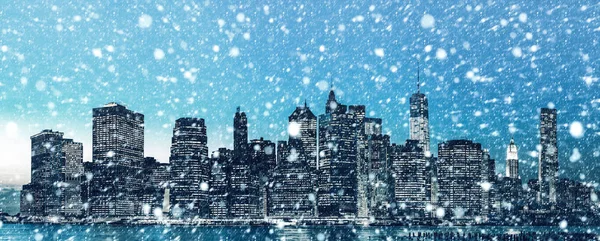 Manhattan at  night. New York City skyline panorama during a snowfall