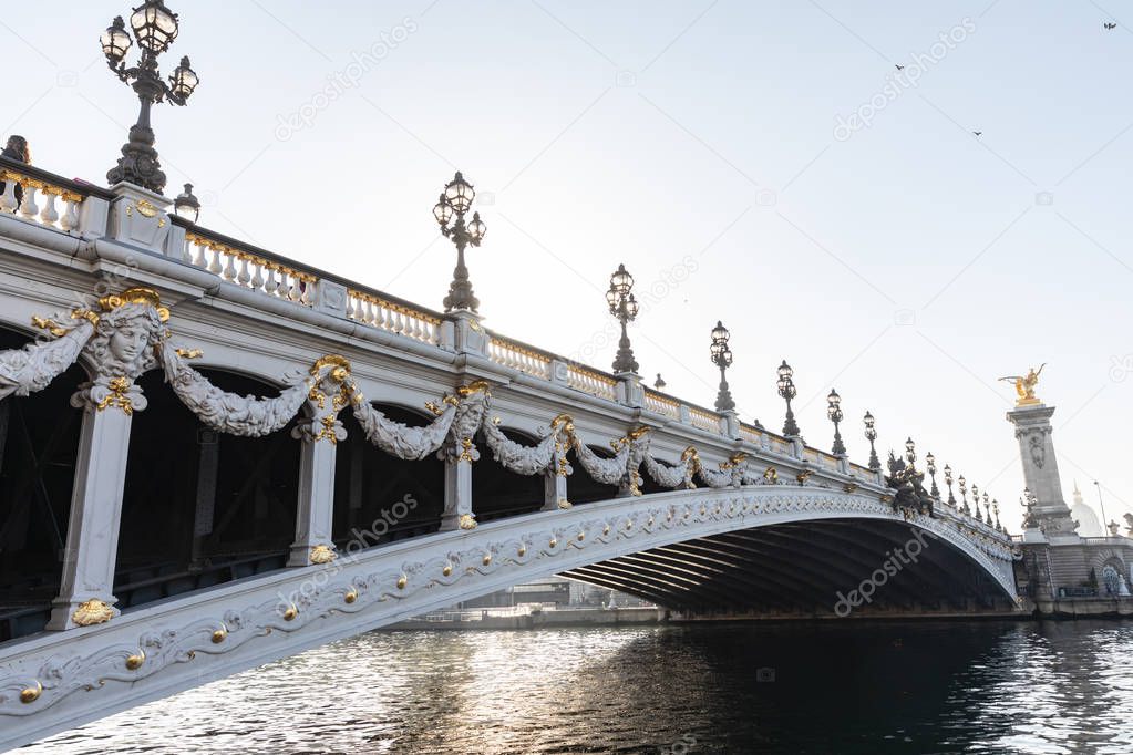 Beautiful bridge of Alexandre III in Paris. Decorated with ornate Art Nouveau lamps and sculptures