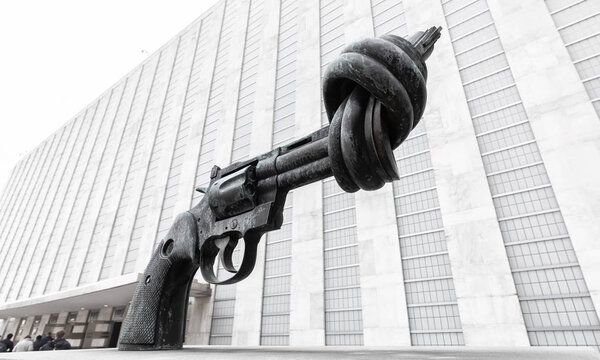 NEW YORK, USA - Feb 20, 2019: Non-Violence is a bronze sculpture by Swedish artist Carl Reutersward of an oversized Colt Python .357 Magnum revolver with a knotted barrel and muzzle pointing upwards