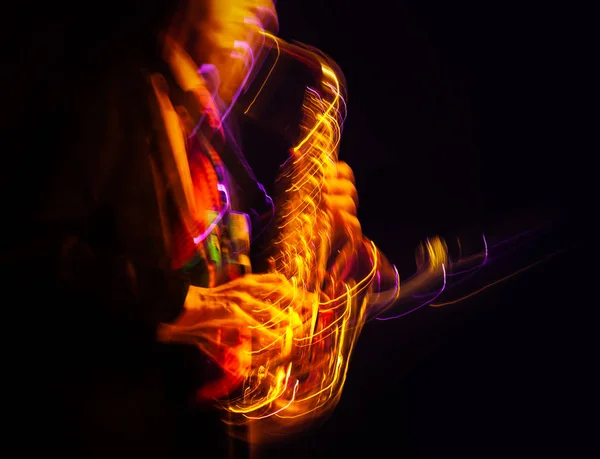 Saxophone player performing on stage — Stock Photo, Image