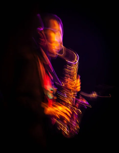 Saxophone player performing on stage — Stock Photo, Image