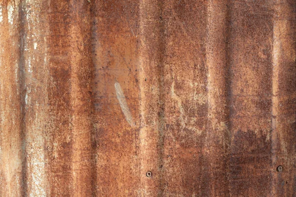 Старая краска на ржавой стене — стоковое фото