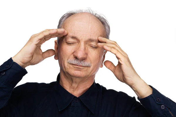 Elderly man suffers from headache — Stock Photo, Image