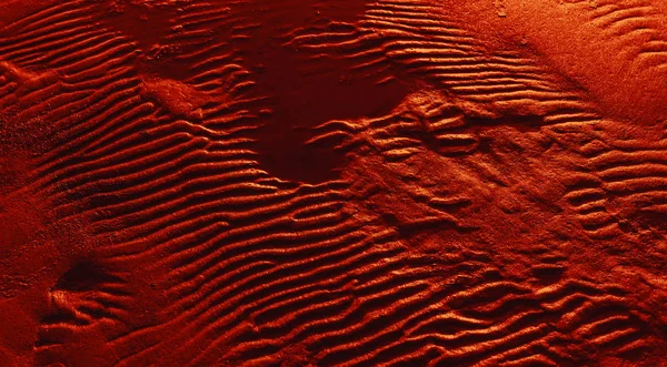 Ripples i våt sand bakgrund textur. — Stockfoto