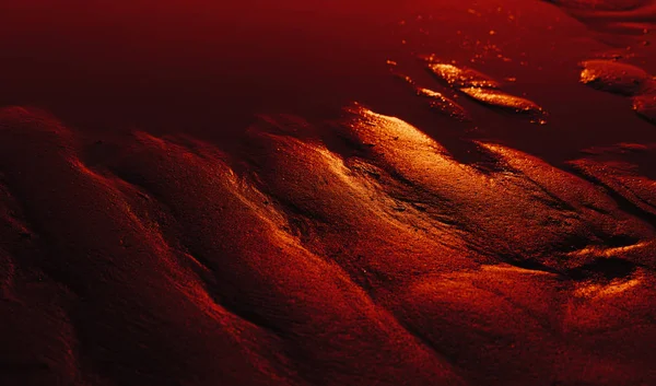 Wellen im nassen Sand Hintergrund Textur. — Stockfoto