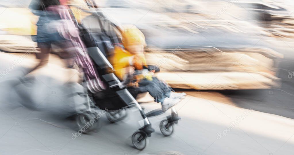 Mother with small child and a pram