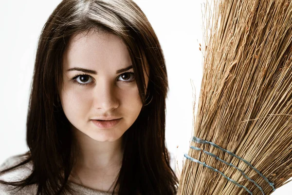 Young woman with a broom — Stock Photo, Image