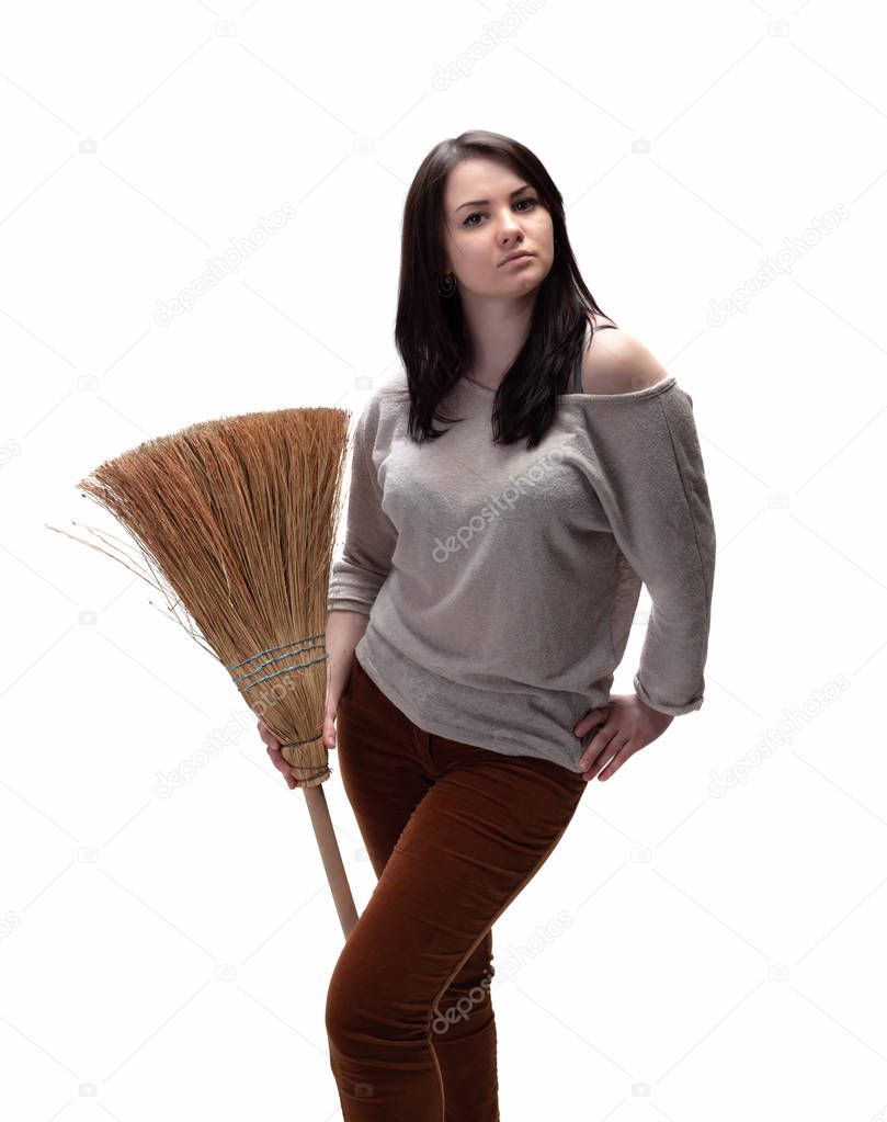 Young woman with a broom