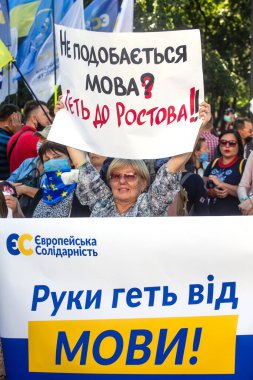 KYIV, UKRAINE - Jul 16, 2020: Mass protests near the Verkhovna Rada of Ukraine in support of the Ukrainian language. Text - Hands off language clipart