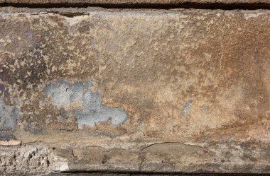Bu soyut resimde eski, dokulu bir duvar, boya katmanları ve yıpranmış.