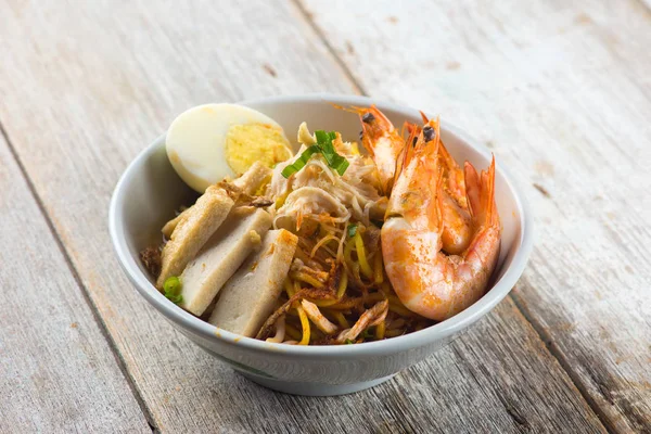 Delicious asian prawn noodle in white bowl