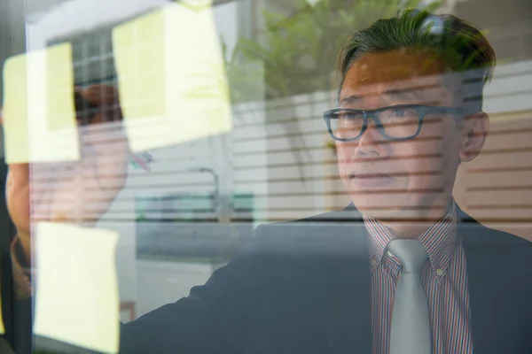 Portrait Asian Businessman Writing Glass Wall — Stock Photo, Image