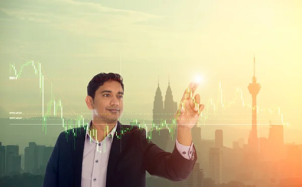 indian male with city background and financial chart screen