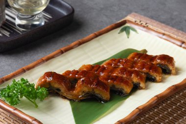 Japanese eel grilled or Unagi ibaraki set on plate  clipart