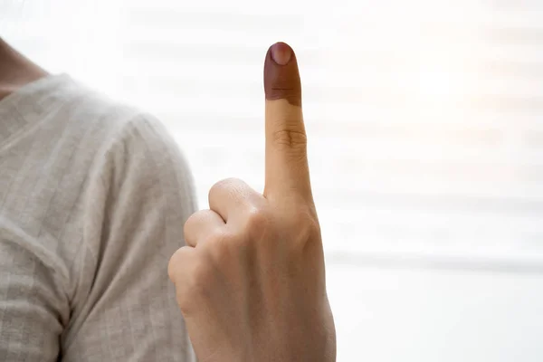 A finger mark with indelible ink at a polling station in Malaysia