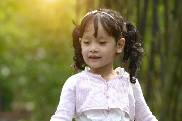 little malay muslim girl playing outdoor