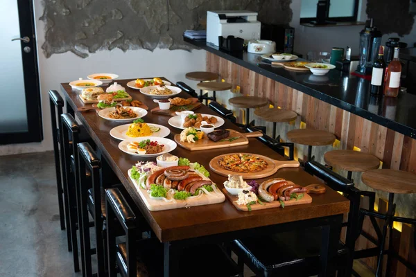 Mixed western and fusion food plates on table