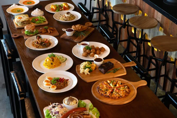 Mixed western and fusion food plates on table