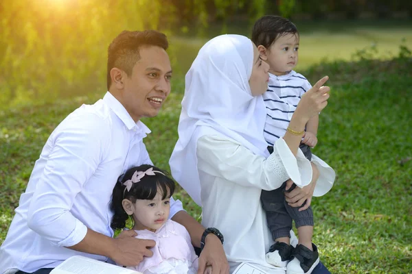 Happy Asian Family Spending Time Together Park Looking Away — Stock Photo, Image