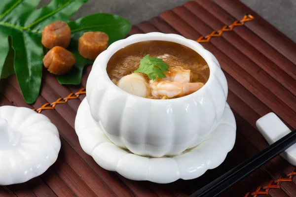 close-up shot of Chinese Shark\'s Fin Soup with scallops and prawns