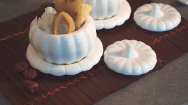close-up footage of Buddha jumping out the wall soup consist of shark fin, abalone and various oriental ingredients