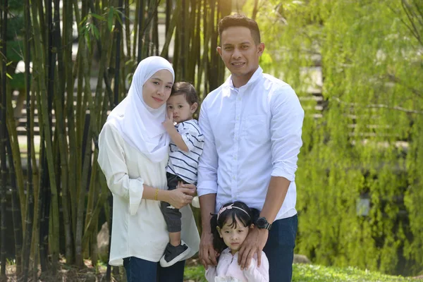 Malay family spending time together in park