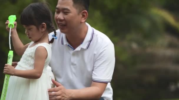 Happy Asian Family Enjoying Time Park — Stock Video