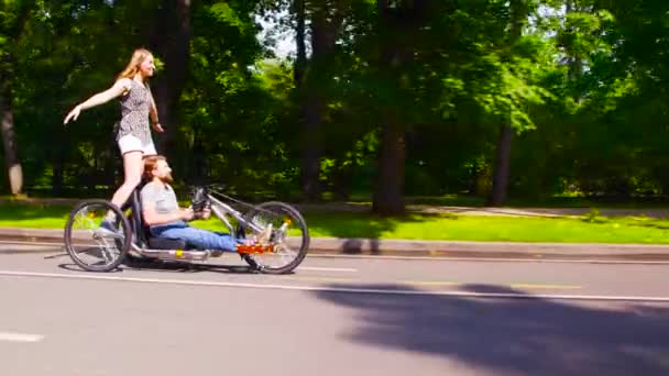 Happy young disable man is riding hand bike — Stock Video
