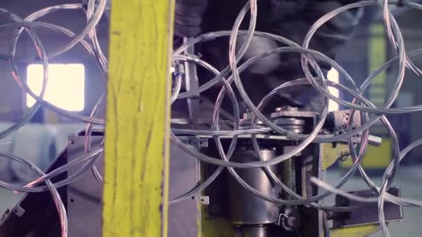 Hands of a worker manufacturing metal net in the factory — Stock Video