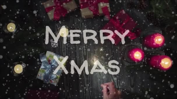 Animation Merry Xmas, female hand holding a sparkler — Stock Video