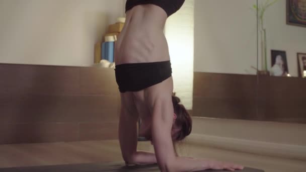 Woman practicing yoga. Forearm stand — ストック動画