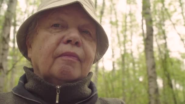 Portrait of senior woman against forest - POV Camera — Stock Video