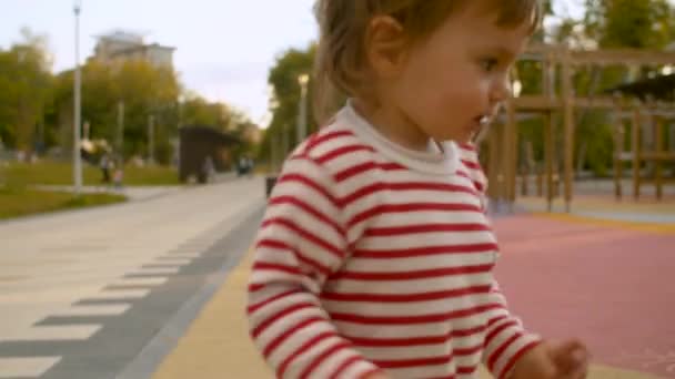 Small girl playing with the doll — Stock Video