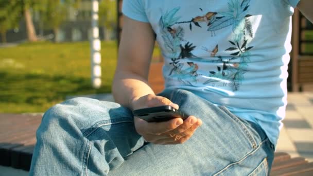 Hand of a man scrolling the smart phone — Stock Video