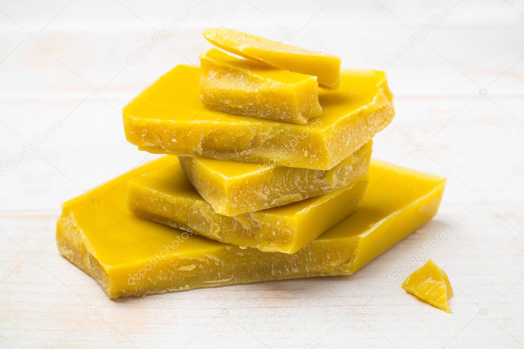 The pieces of natural pure organic yellow beeswax for natural beauty and DIY project.