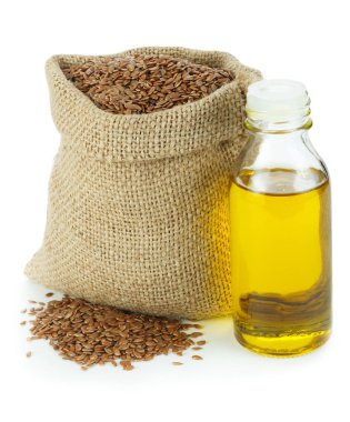 Keten tohumu yağı ve keten tohumları küçük çuvalda.