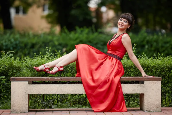 Attractive Young Girl Red Dress Sitting Bench Park — Stock Photo, Image