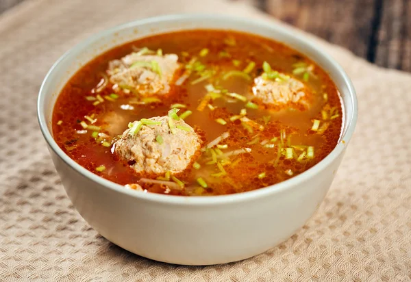 Closeup of a bowl with Mexican meatballs soup on a wooden board — Stock Image Closeup Bowl Mexican Meatballs Soup Wooden Board Royalty Free Stock Photos