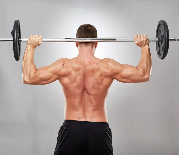 Man Doing Shoulder Workout Barbell Gray Background — Stock Photo, Image