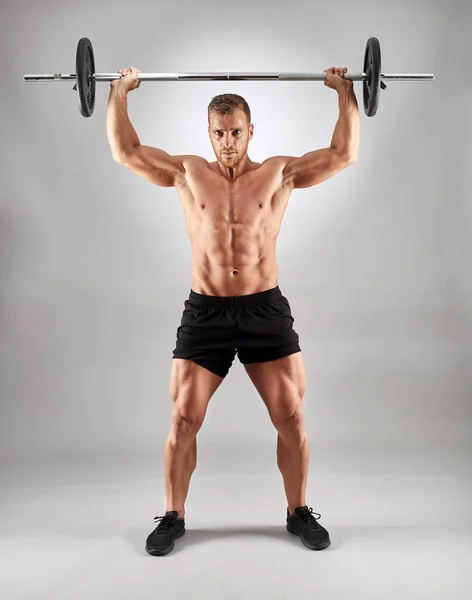 Man Doing Shoulder Workout Barbell Gray Background — Stock Photo, Image