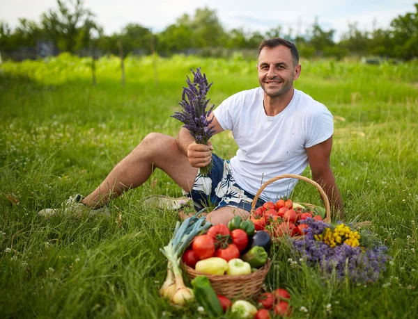 Happy Farmer Sitting Grass Basket Various Vegetables Lavender Bouquet — Stock Photo, Image
