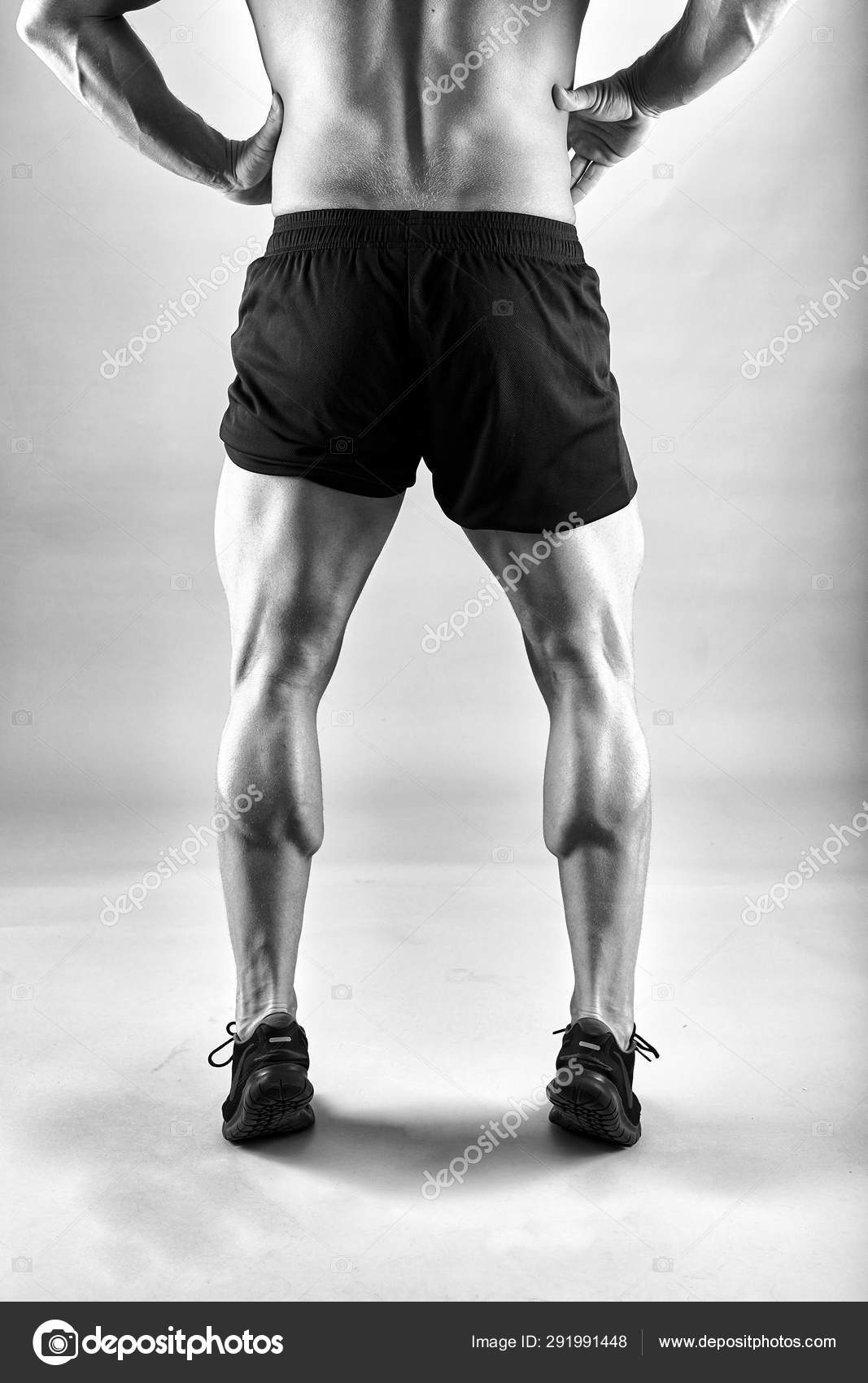 Fitness Model Displaying Strong Calves Legs Stock Photo by ©Xalanx