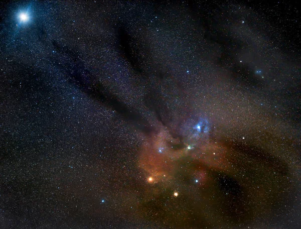 Rho Ophiuchi stars cluster and nebula with Jupiter in the upper left corner