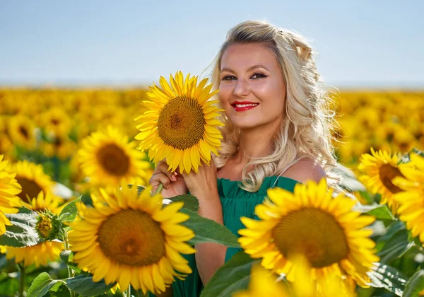 Beautiful blonde Caucasian woman in a sunflower field