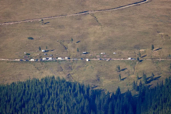 Offroad cars and trailers camped on a mountain