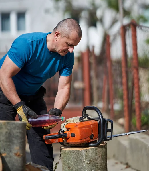 Lumberjack Refilling His Chainsaw Specific Mixture Gas Oil — Stock Photo, Image