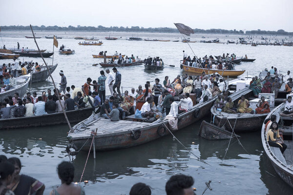 VARANASI, UTTAR PRADESH, INDIA - JULY 7, 2018: Pilgrims bathing and performing ritual at the water holy Ganges river