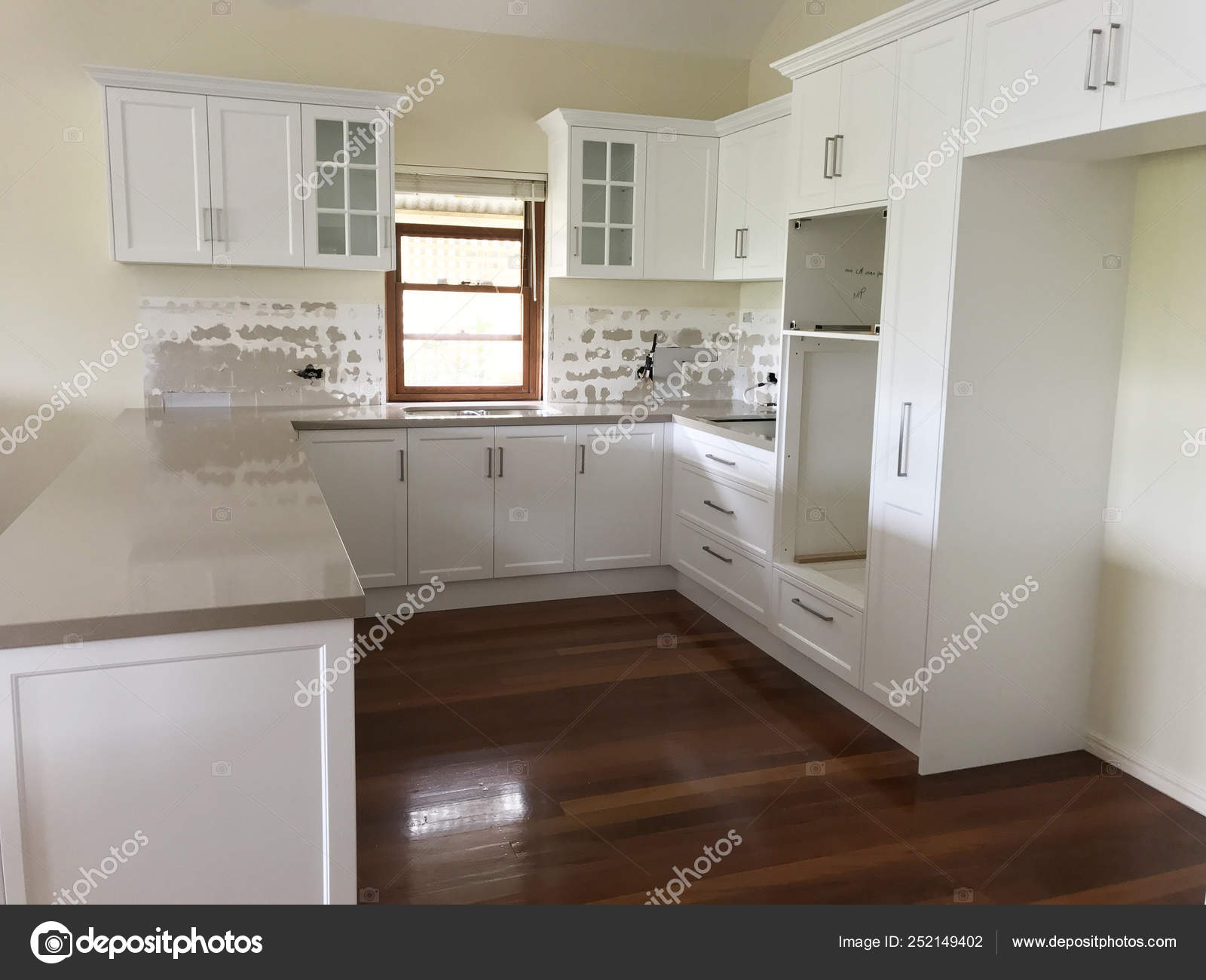 Extensive Kitchen Renovation New Stone Bench Tops White Cupboards